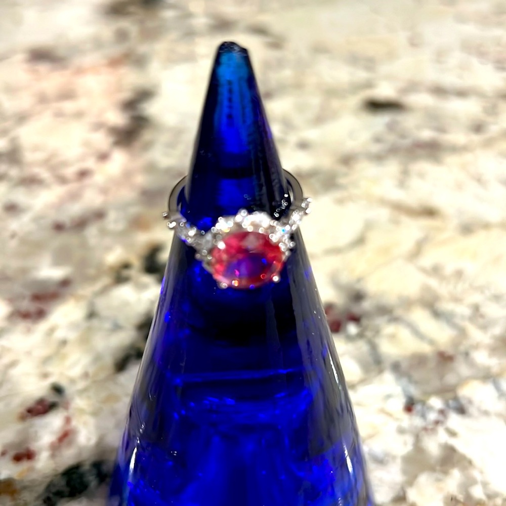 Beautiful big pink stone with rhinestones around it